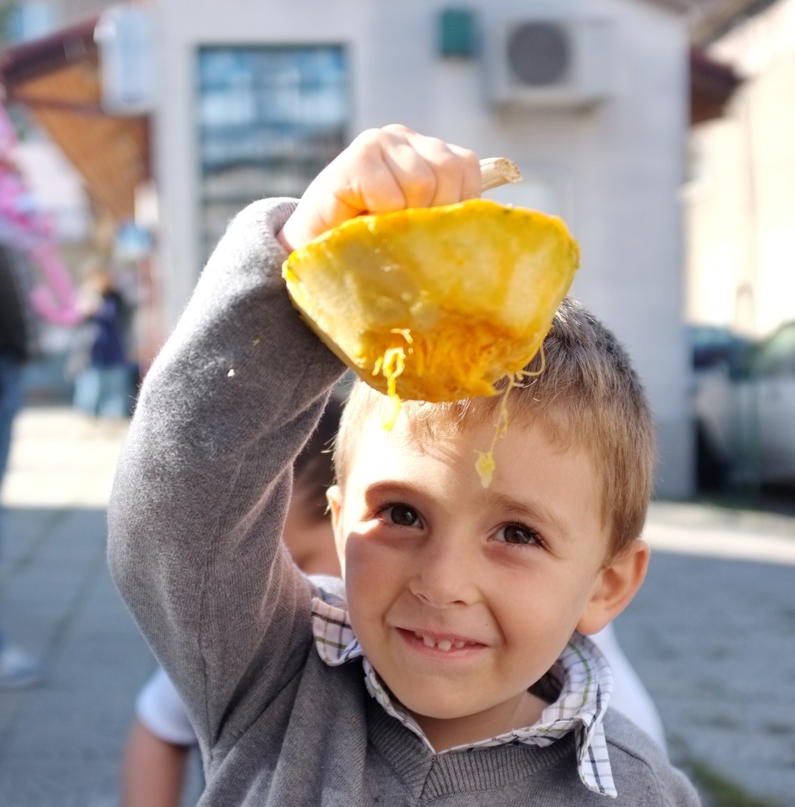 a little boy that has food on his head