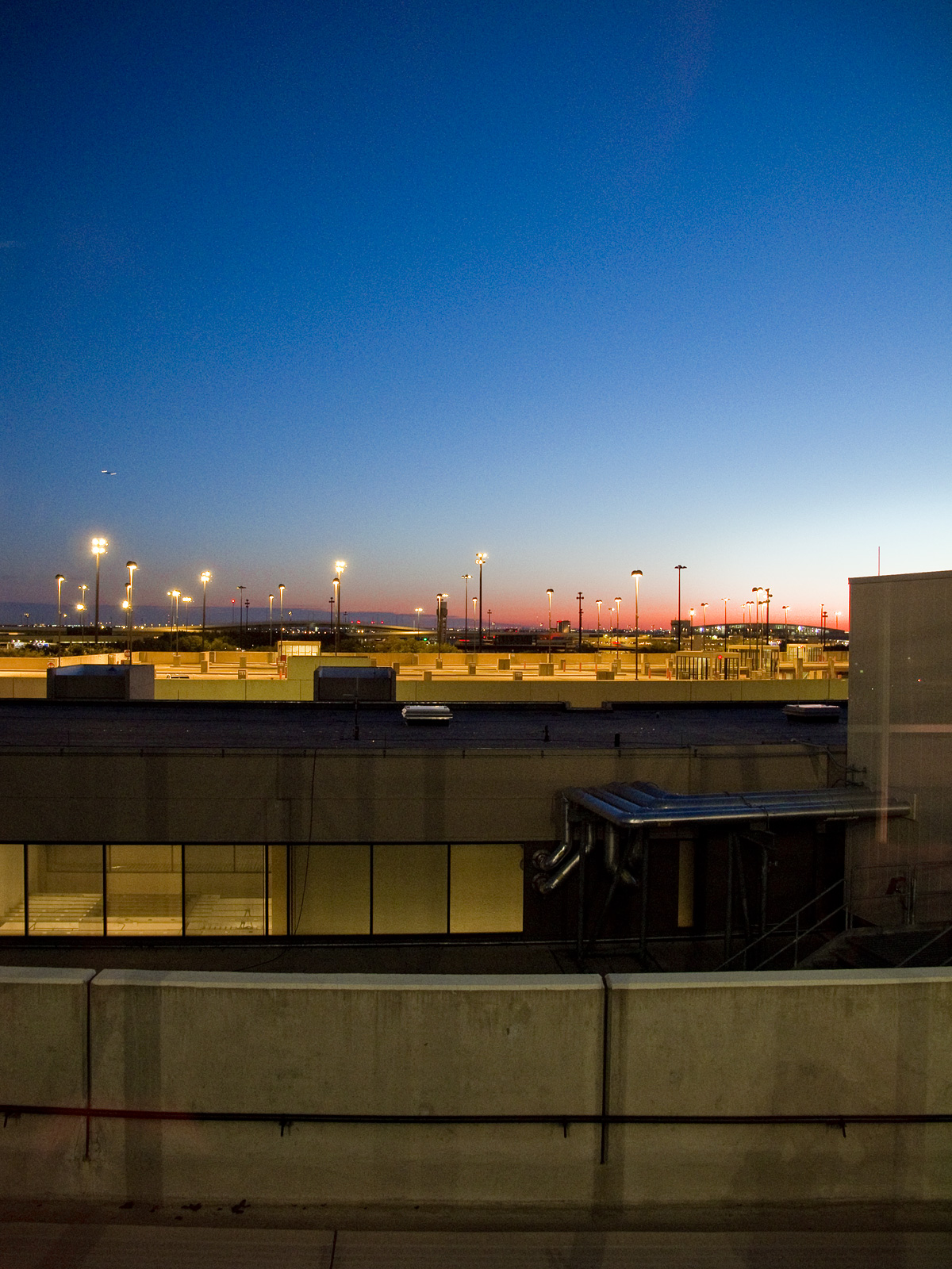 some planes are parked on an airport runway