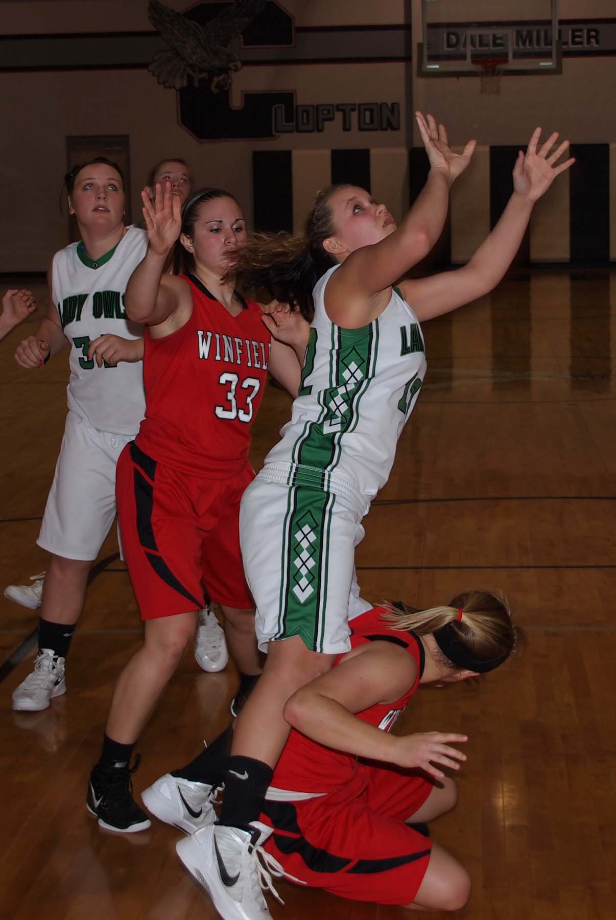 some girls in a team are trying to reach the ball