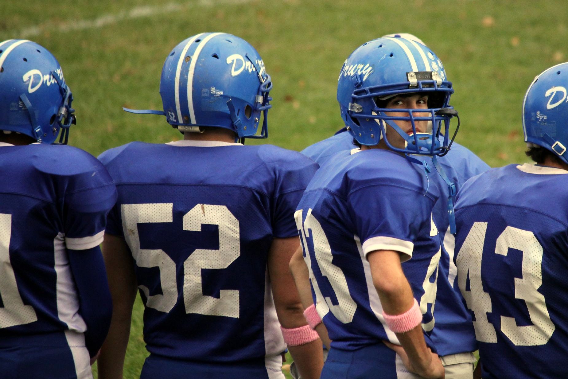 a group of football players from the middle back