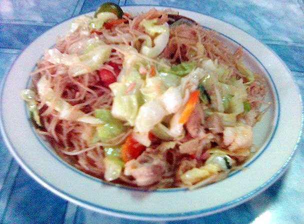 a small bowl filled with noodles and vegetables