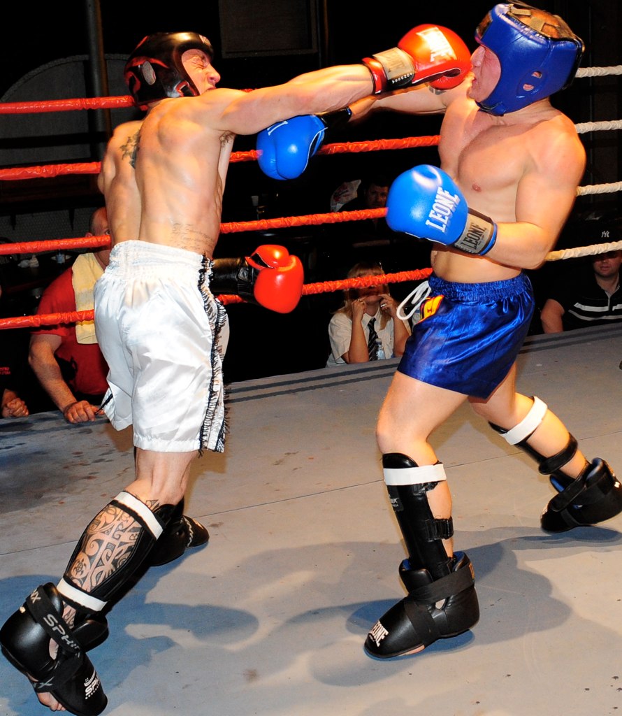 two men with boxing gear in a ring