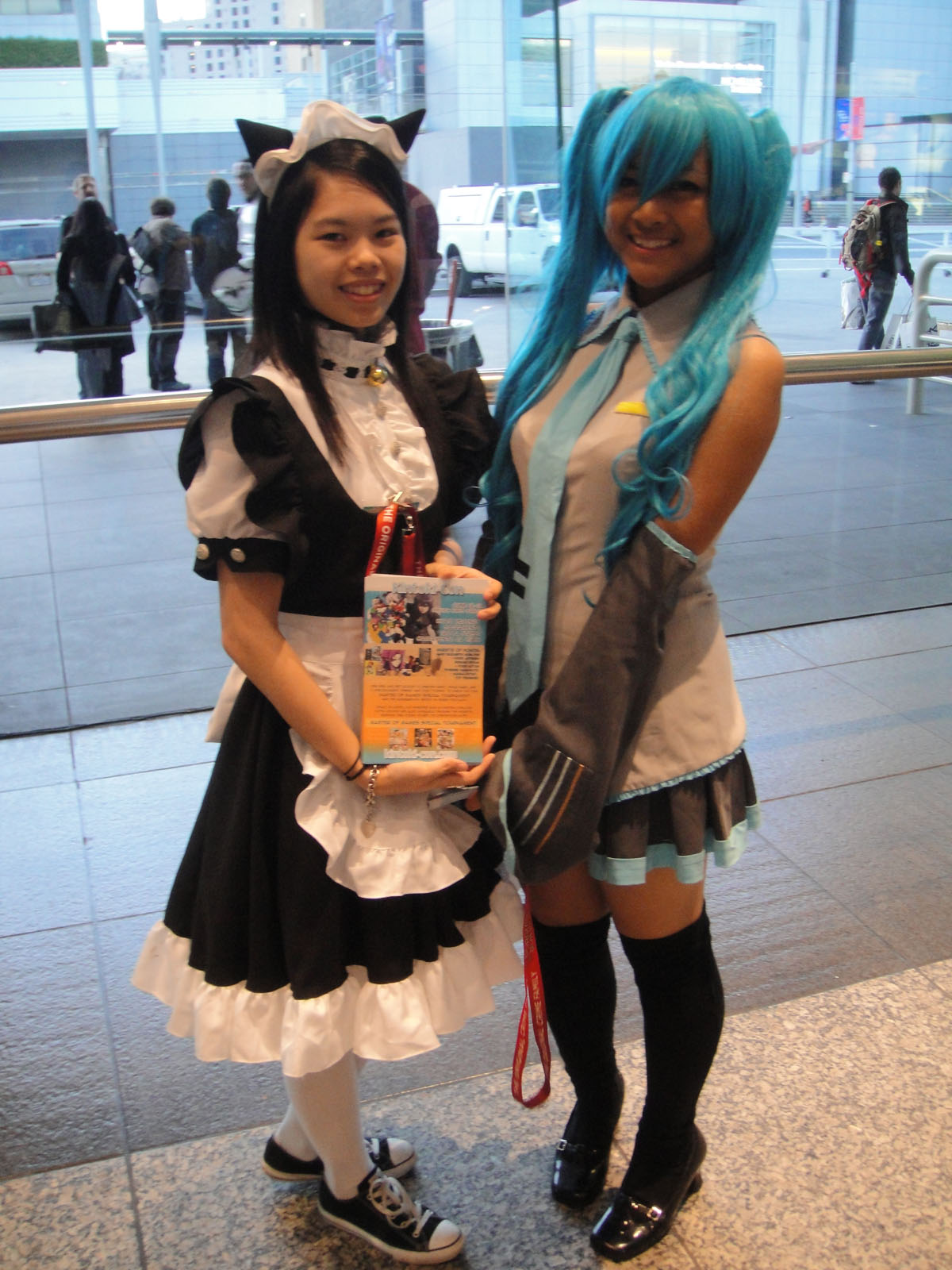 two girls dressed in costume standing next to each other