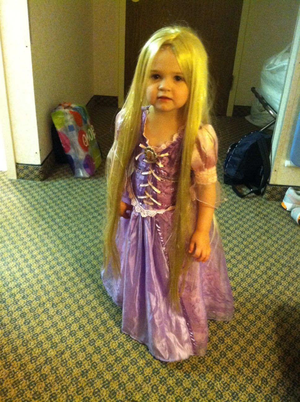 a very pretty  dressed in a purple princess costume