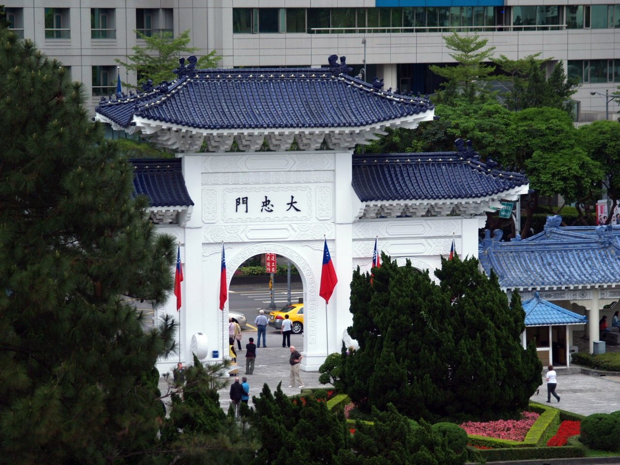 a white tower with a blue and red top