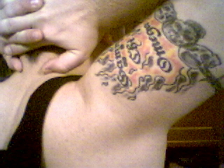 the arm of a man with tattoos and  on