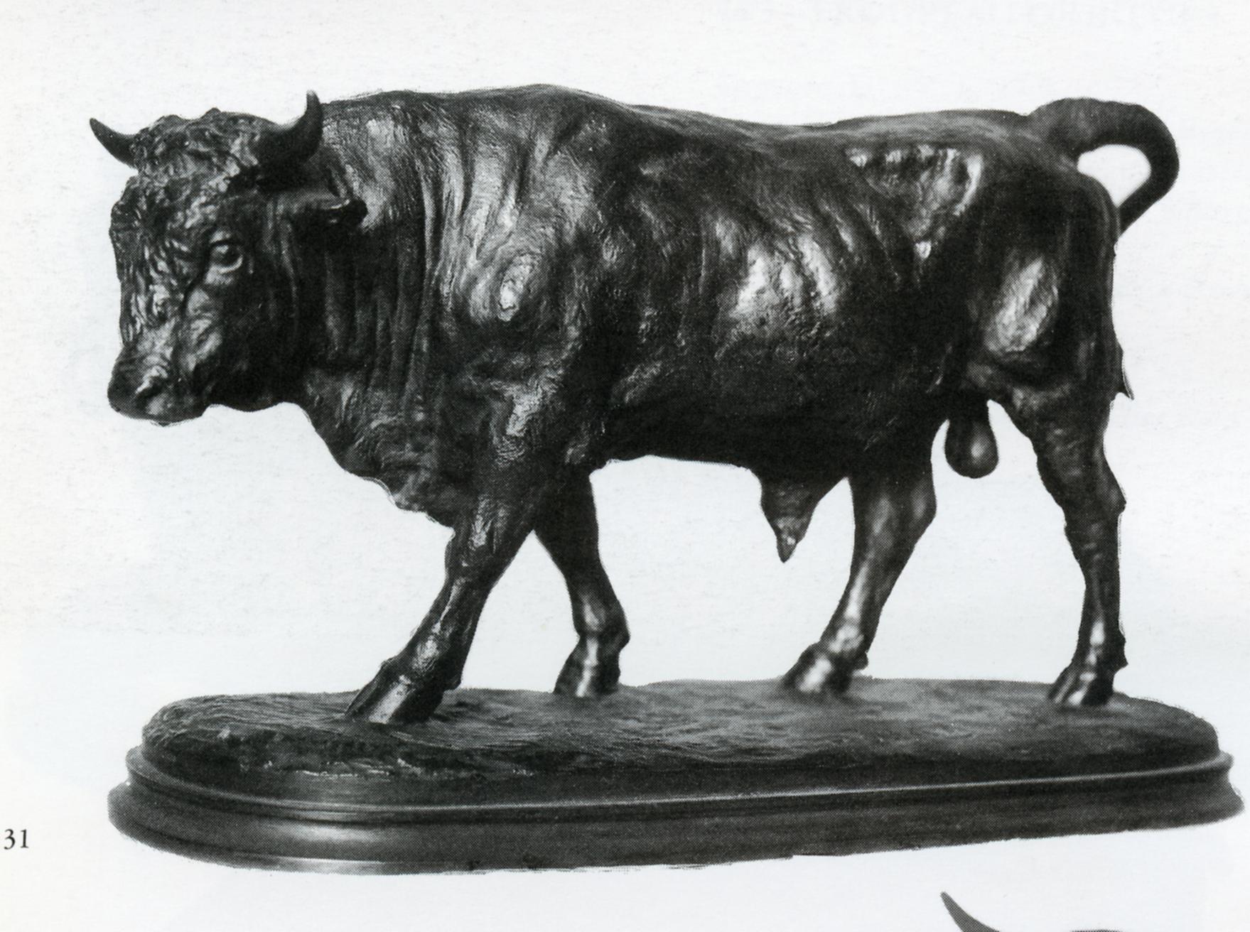 a black and white po of a statue of a bull