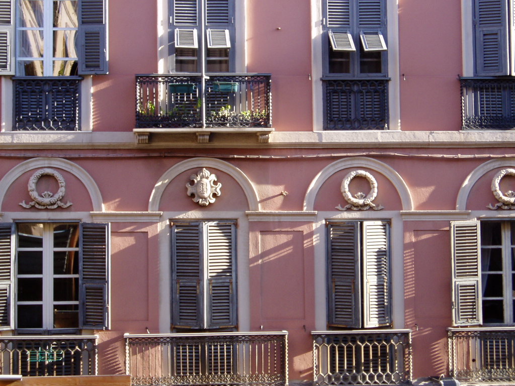 two different windows with shutters on each side