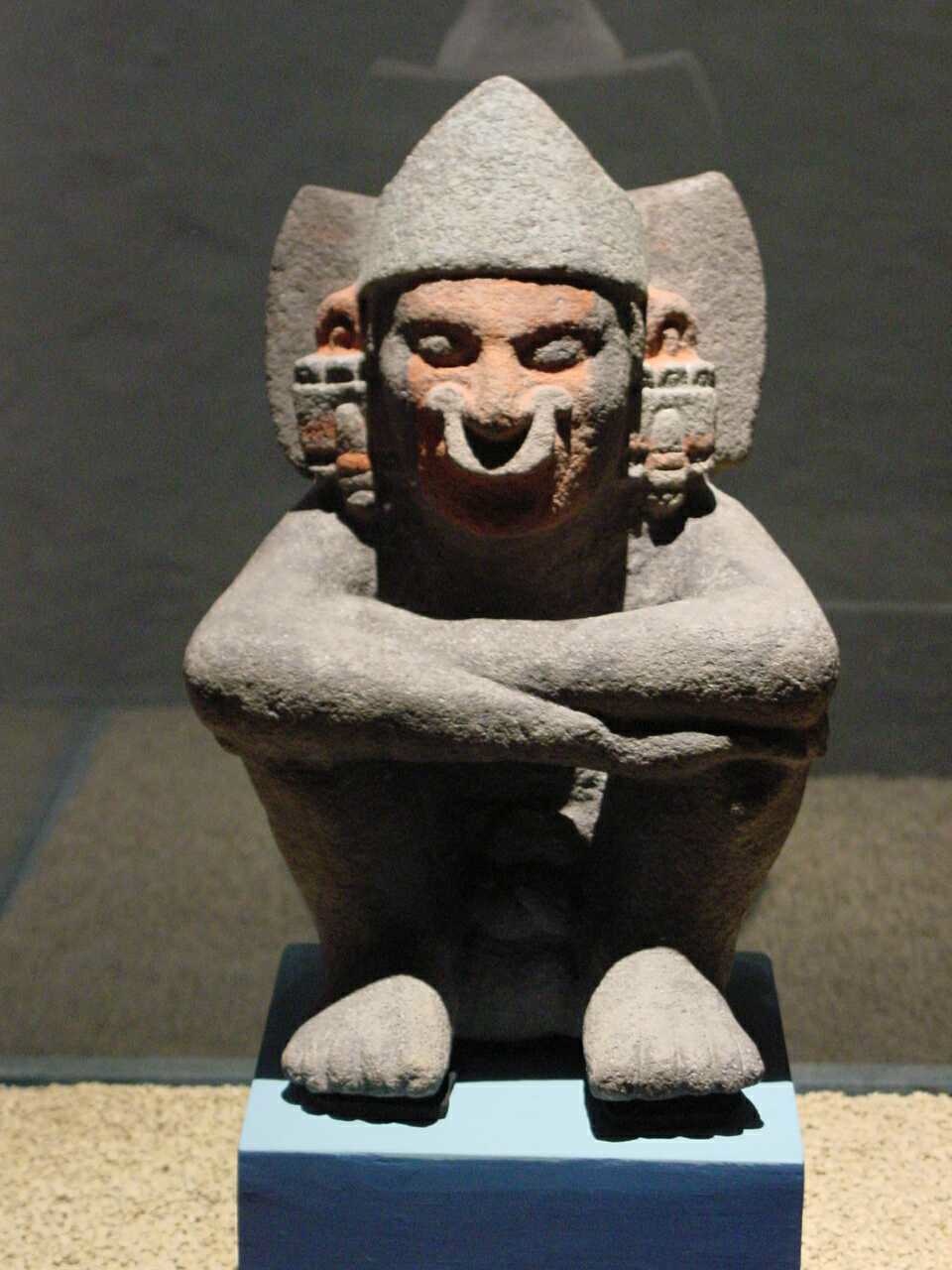 a sculpture of a man with a surprised face