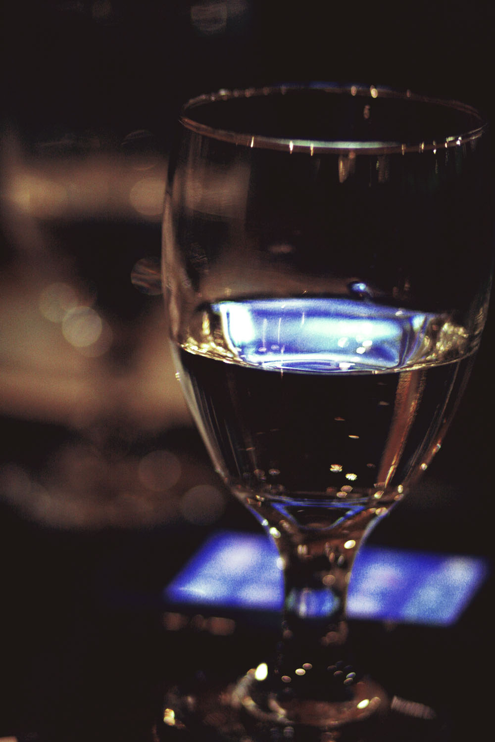 a glass of water sitting on a table