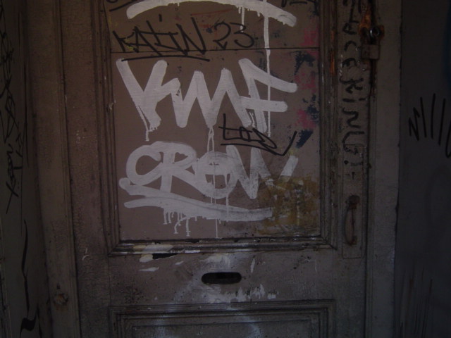 a door with writing and writing on it