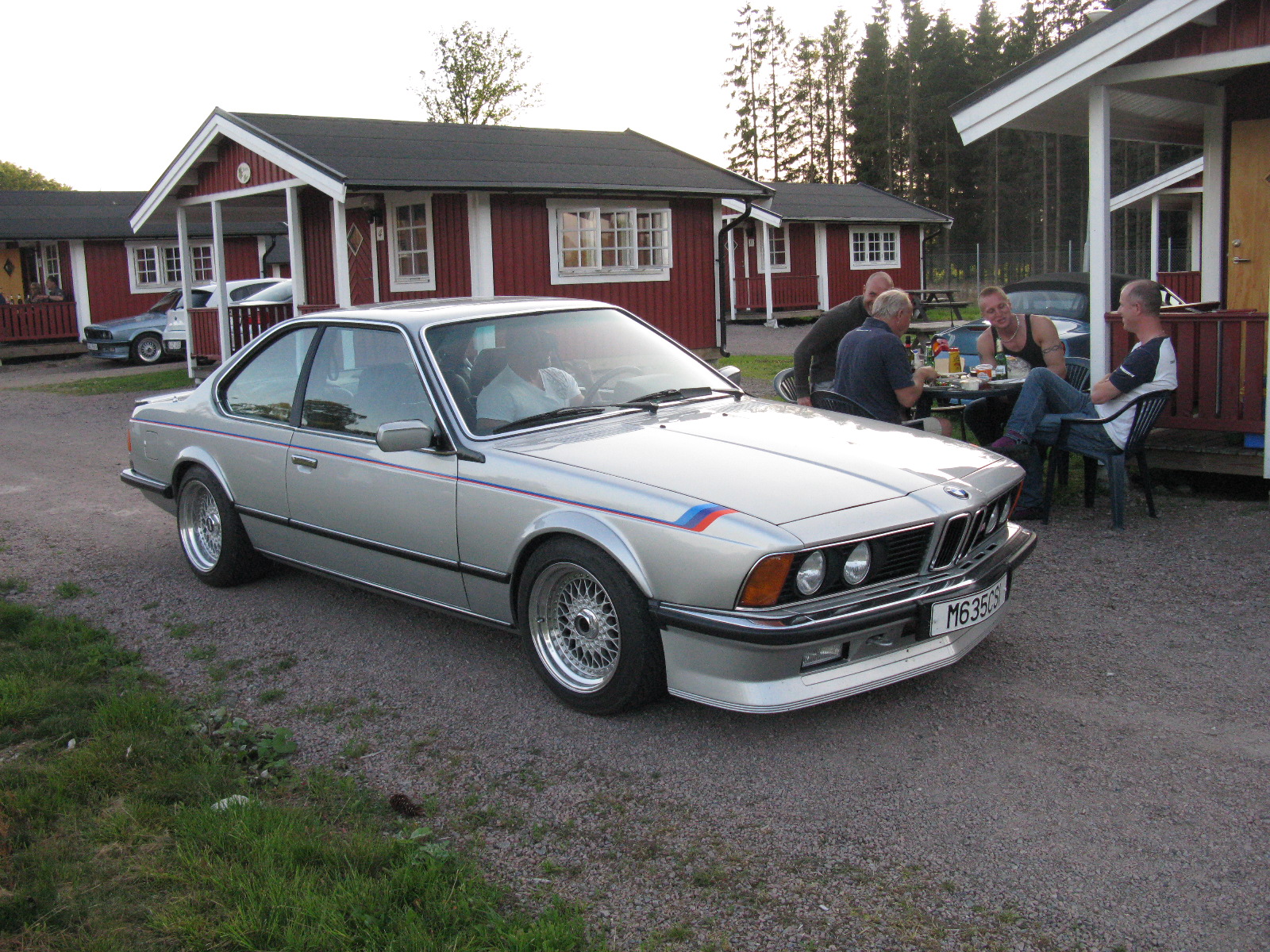 a car that is sitting out on the grass