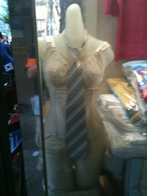 a mannequin is dressed up in a shirt and tie