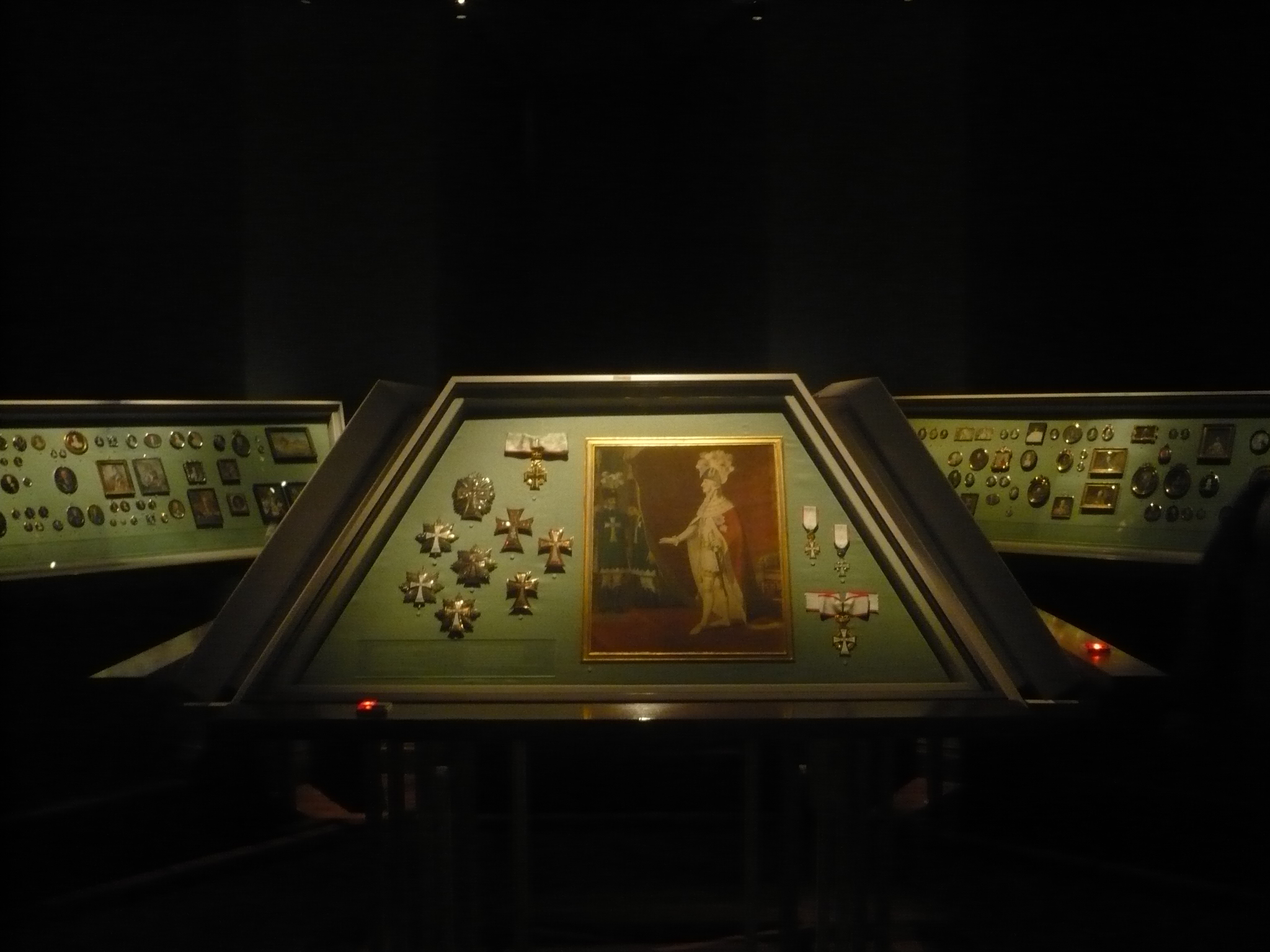a display case contains many different pieces of art