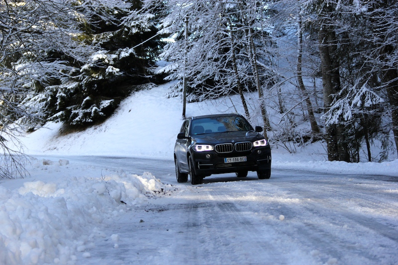 a car is parked on a snowy road