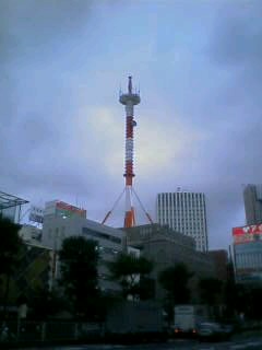 a large tower that is in the middle of a street