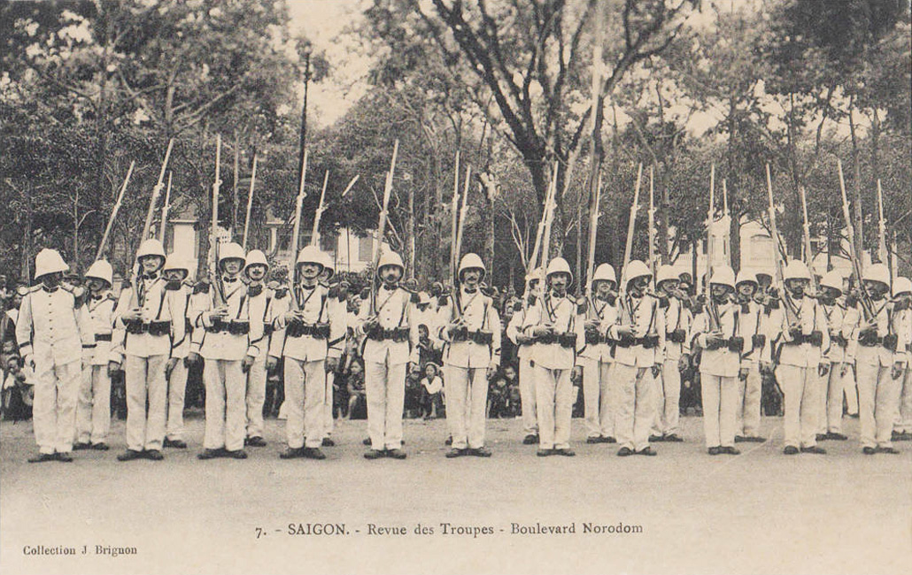 black and white pograph of several people with marching gear