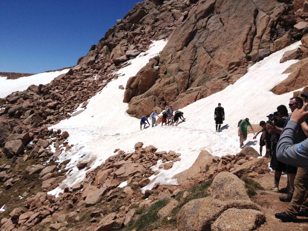 a group of people hiking on a snowy mountain