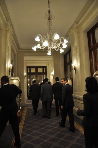 the men are entering the building in the evening