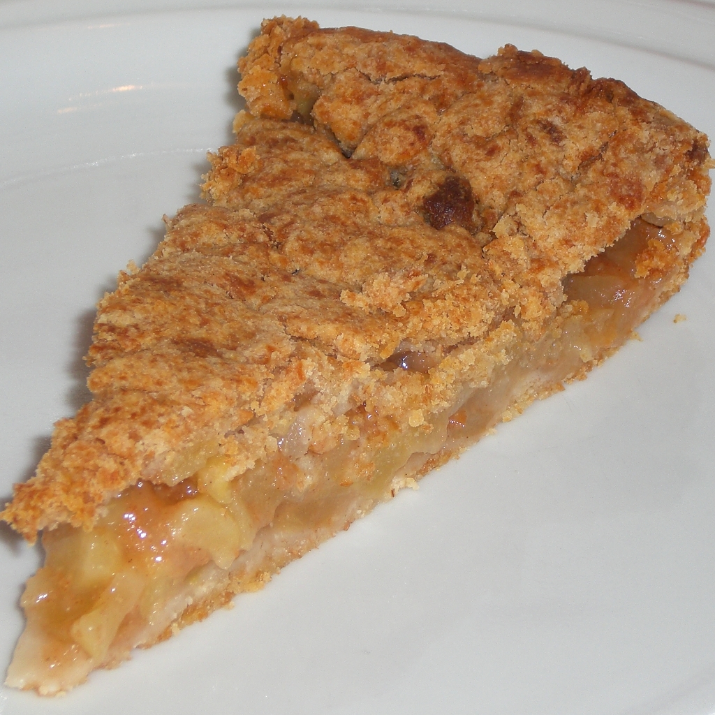 an individual slice of pie with apple topping on a plate