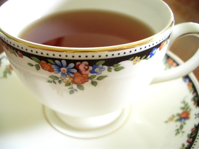 a cup of tea is on a saucer