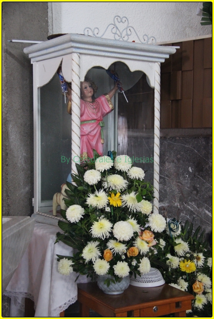 a statue of christ hangs on the front door