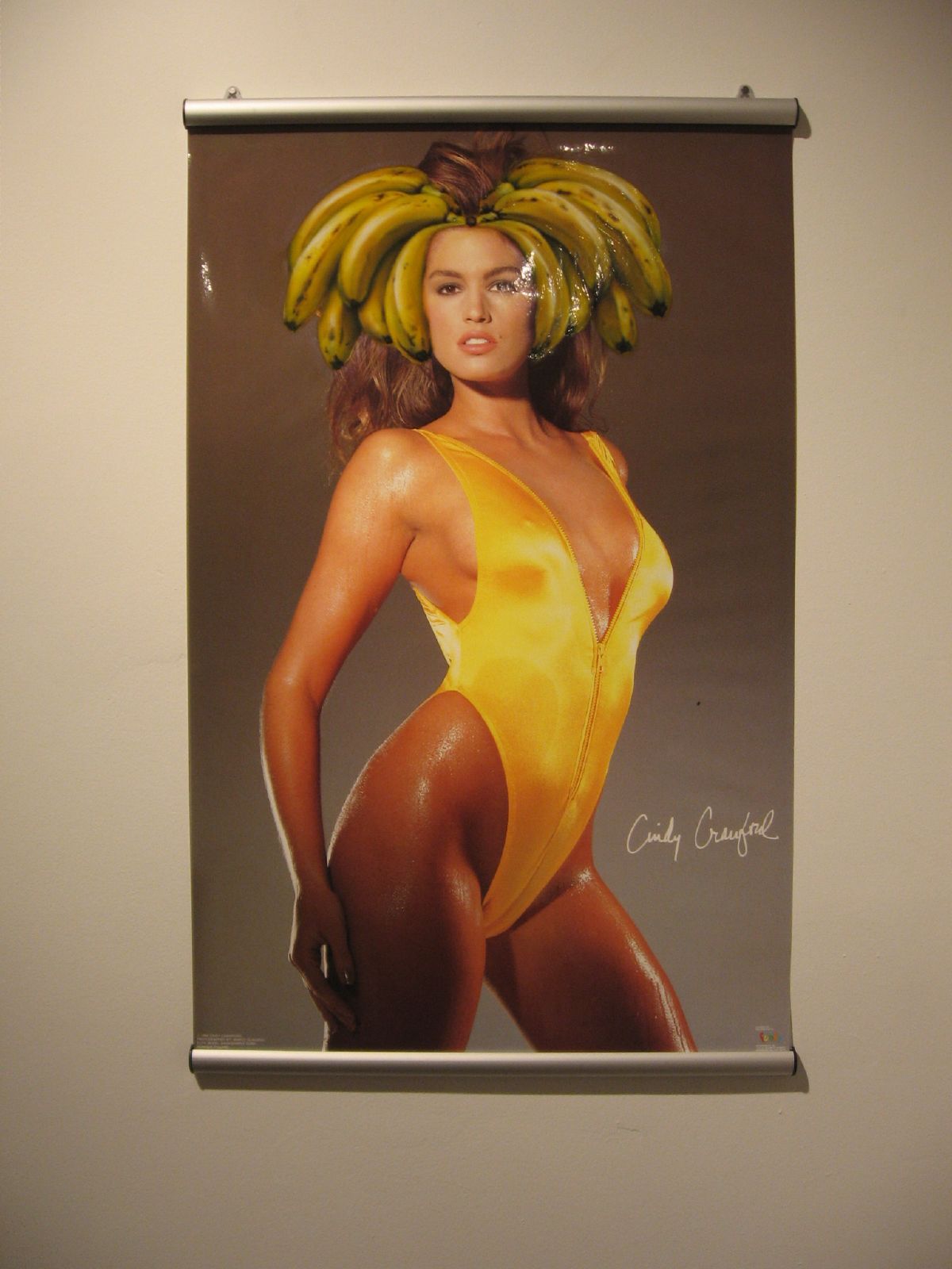 an art installation depicts a woman in a body suit and bananas on her head