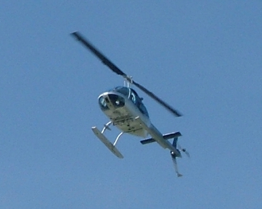 a small helicopter is flying thru the air