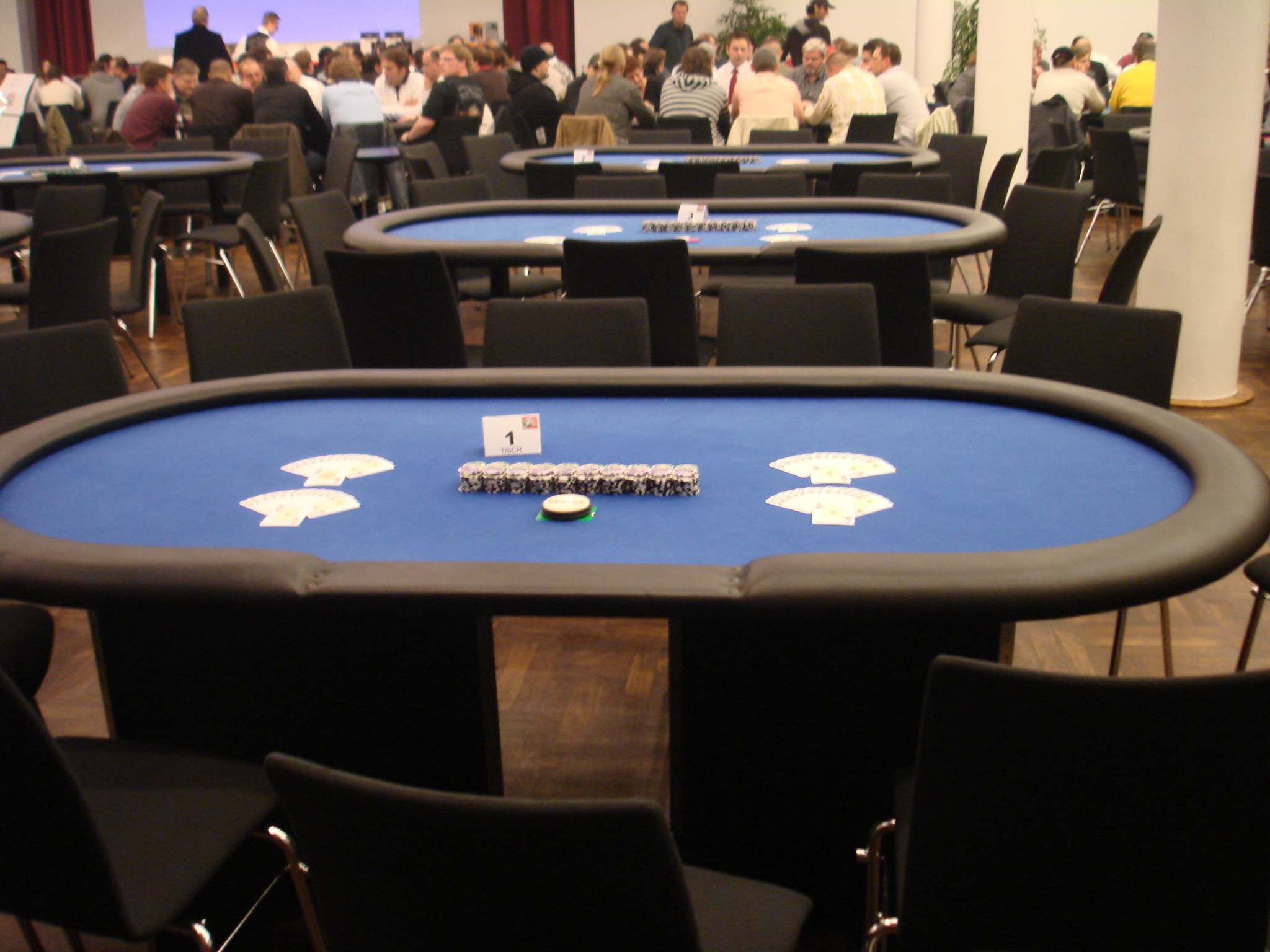 a table that has some cards on it in a room