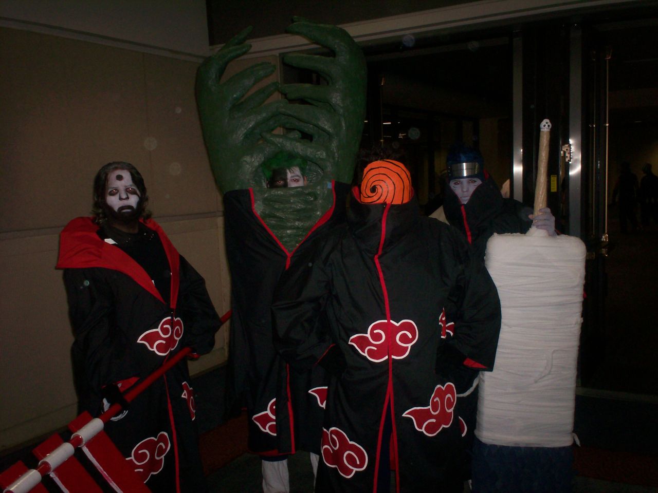 three people dressed in costume pose together for a po