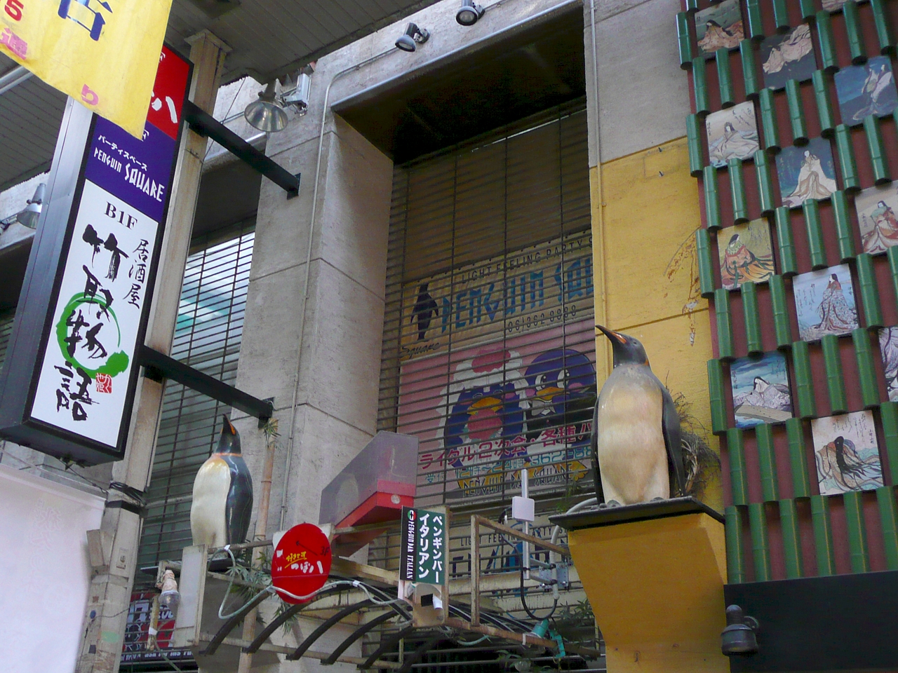 the bird is perched on the balcony of the building