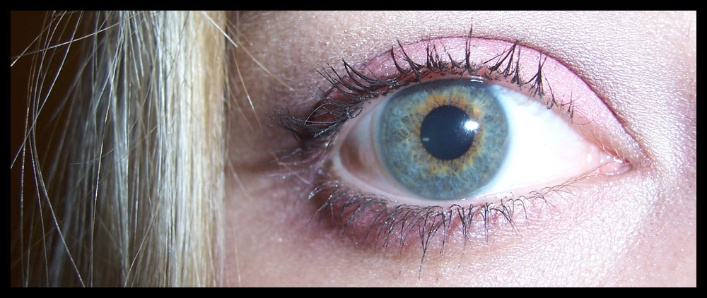 closeup of the eye of a woman, blonde - haired