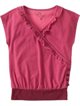 a pink blouse with a ruffle on the collar