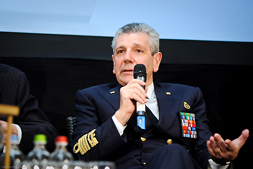 a marine captain is speaking on a microphone