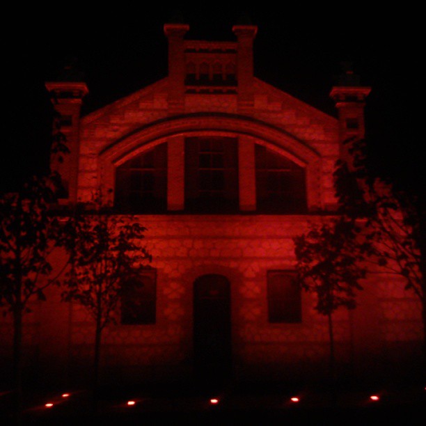 the front of a church that is red in color