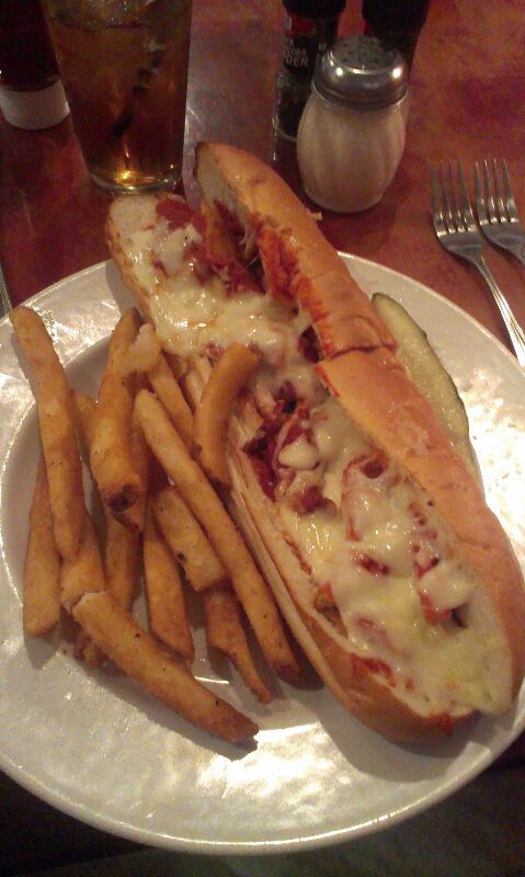 plate with french fries and chili cheese dog on it