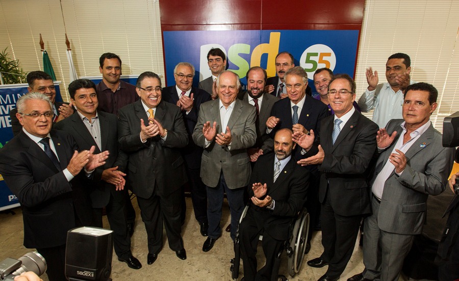 a group of men standing around each other