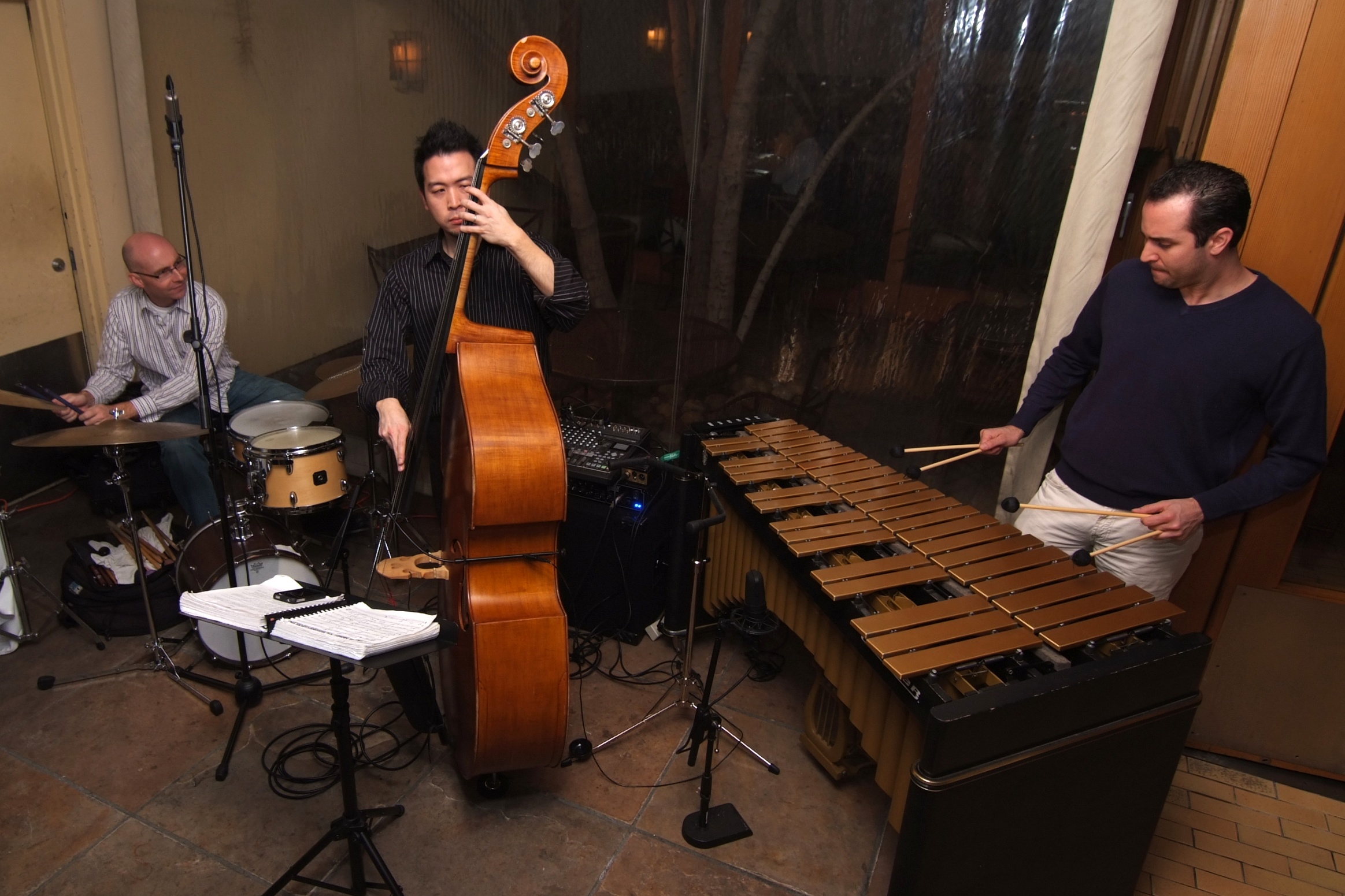 a group of people with musical instruments in a room