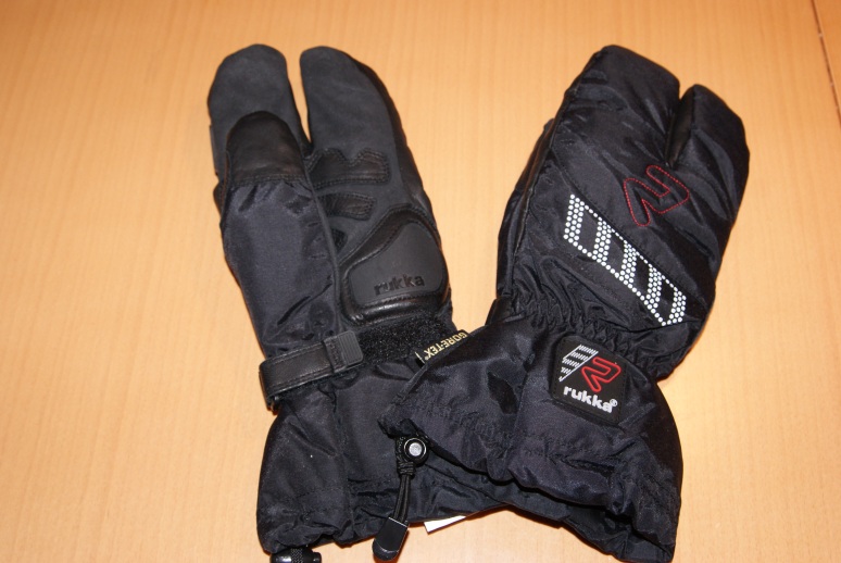 a pair of gloves sits on top of the table