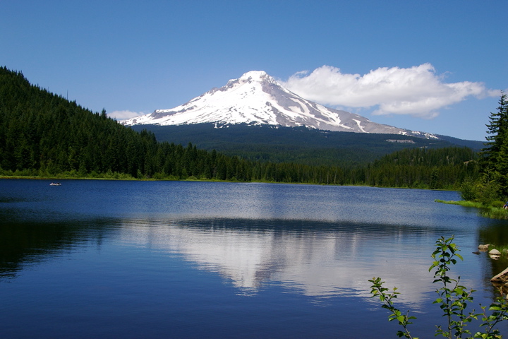 a mountain that is sitting above a lake