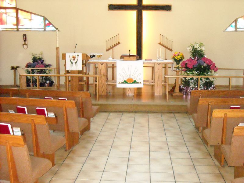 view of the inside of a church from the pew