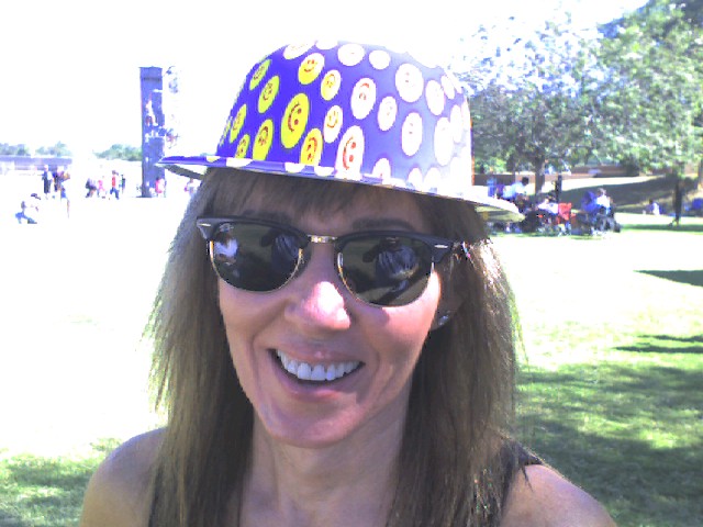 a women who is wearing a hat with ons