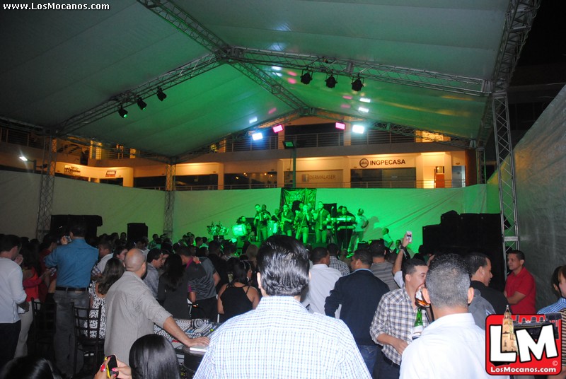 a large group of people are gathered under a tent