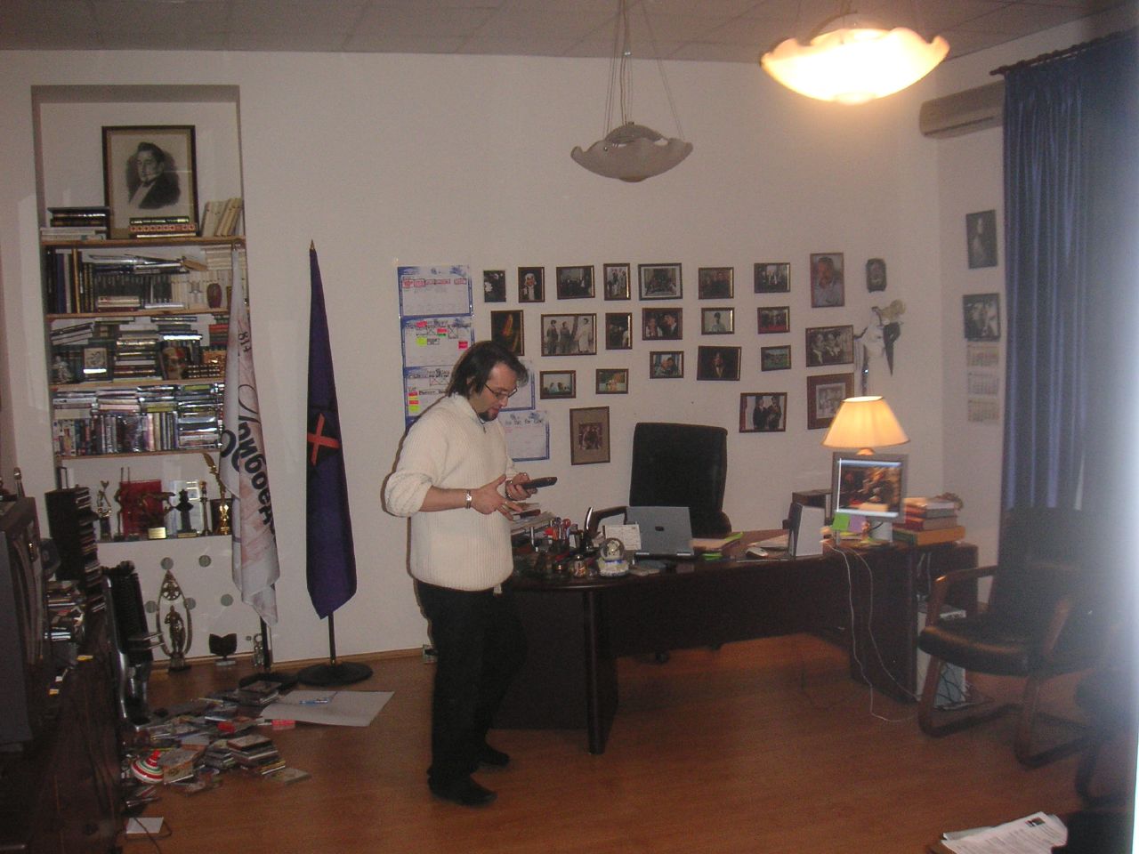 a person standing at a desk with some paperwork