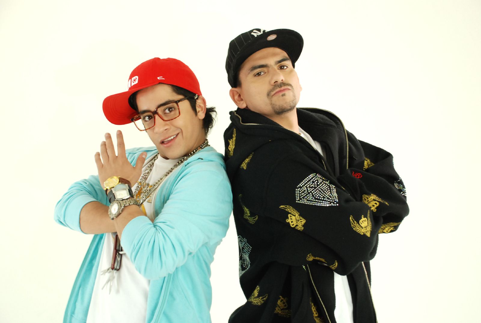 two male friends posing in casual clothes and caps