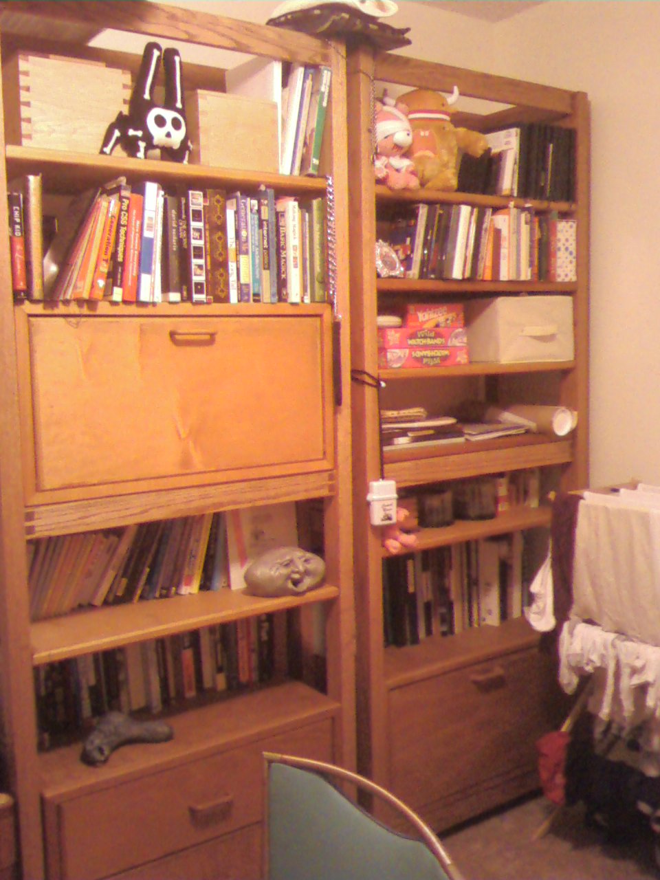 a room with a book shelf filled with books