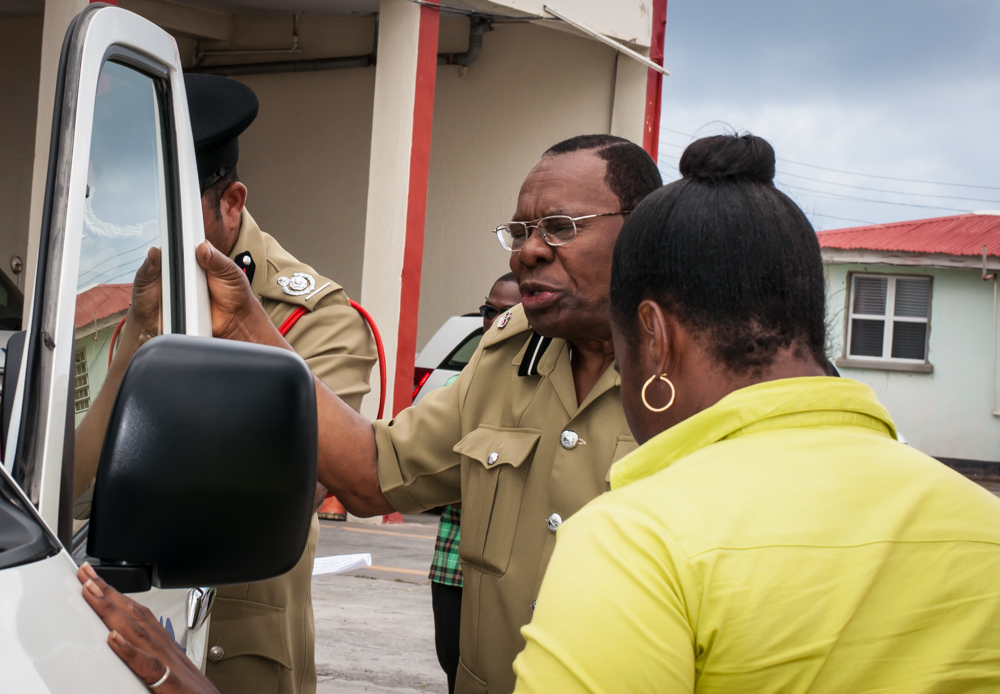 man getting out the truck of an officer's home with a woman