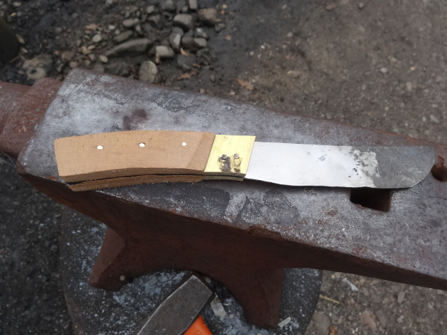 a knife on an iron beam with a tool