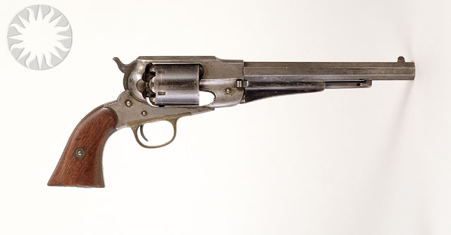 a metal gun with wooden grips and the side handle removed