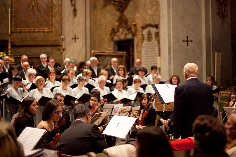 orchestra performance with conductor and conductor, in the foreground